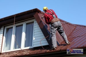 roofer repairing red metal roof