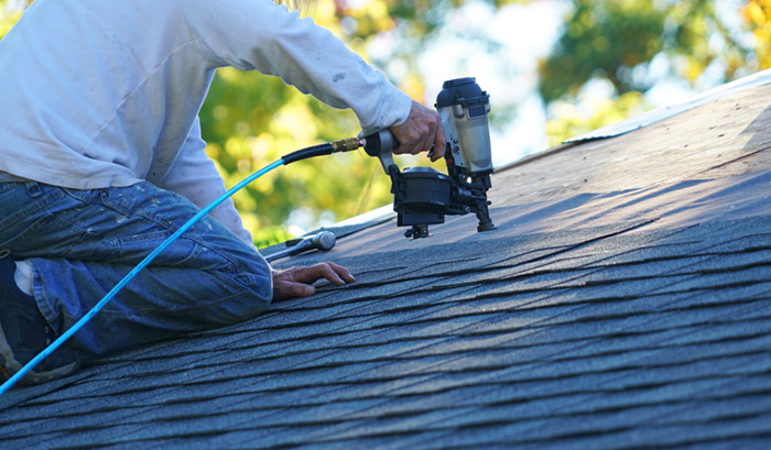 roofing contractor with nail gun