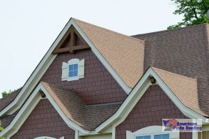 shingles on sloped roof with gabled windows