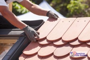 roofer installs tile roof