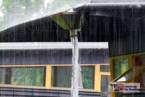 water overflowing from roof gutter