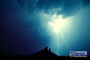 blue thundercloud and lightning over house