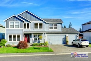 shingle roof on blue suburban home